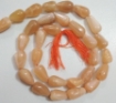 Picture of Peach Moonstone top drilled drop beads